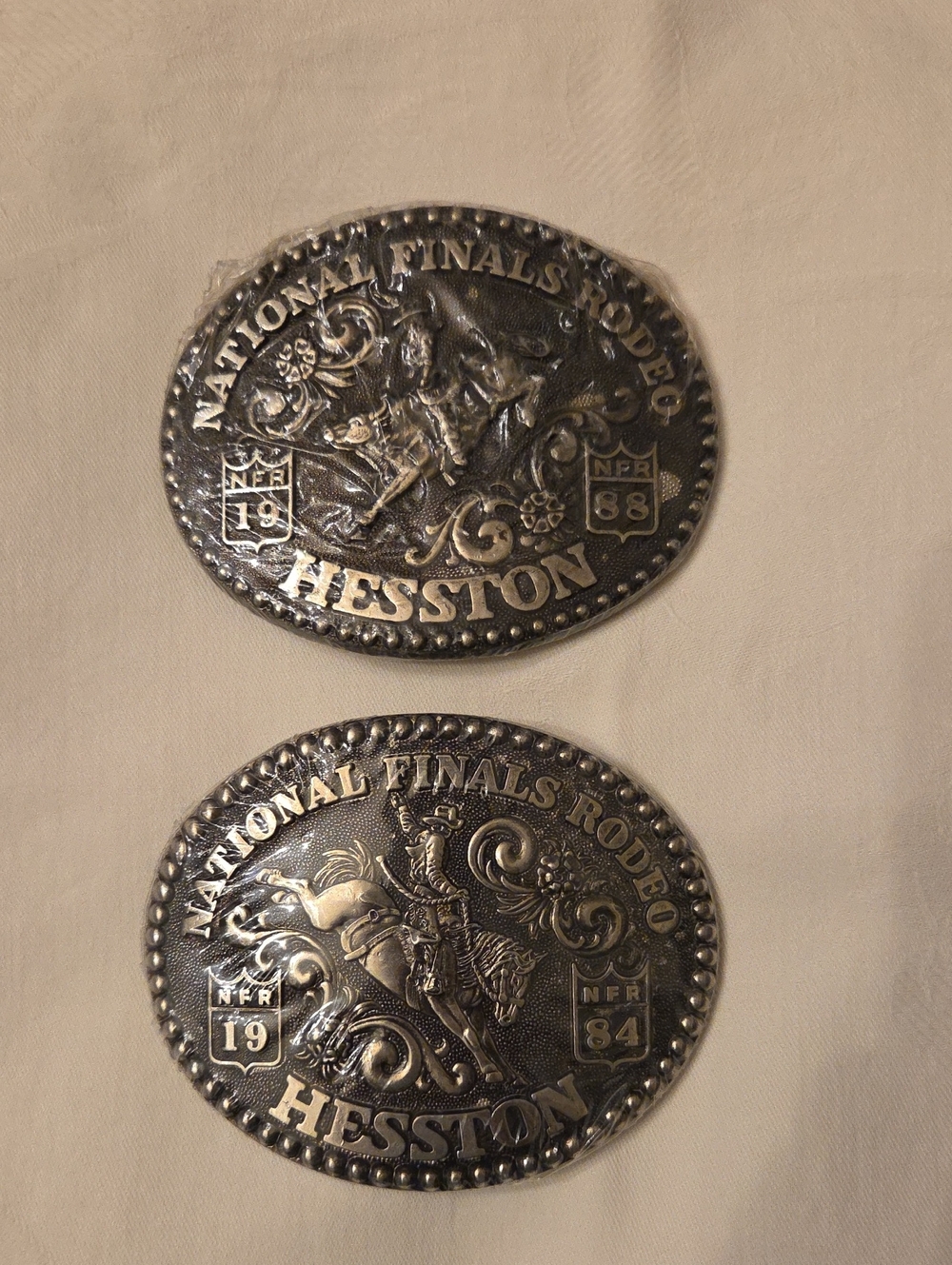NFR Commemerative Hesston Beltbuckles 1984 & 1988